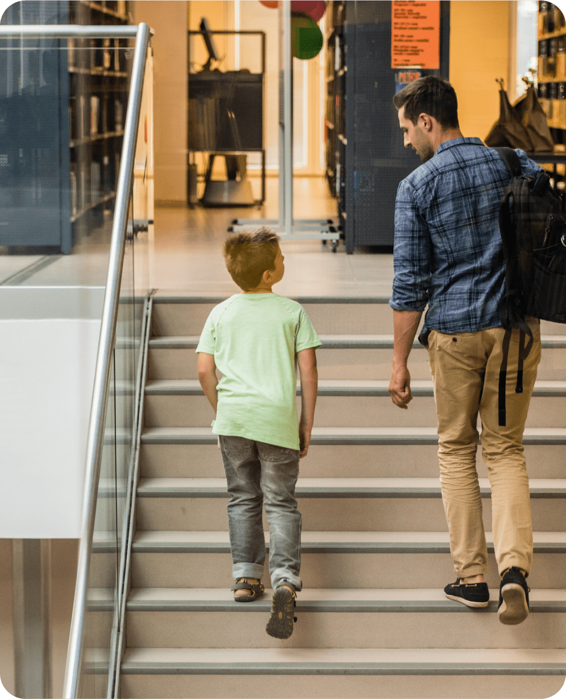 teacher helping student on computer