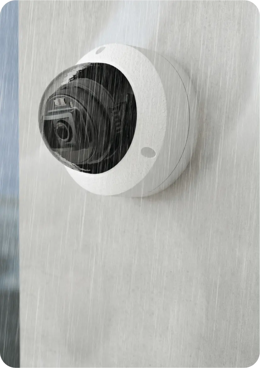 Rhombus R120 Mini Dome Camera placed on a wall- Outdoor IP Camera with Night Vision, Wide Dynamic Range, Motion Detection, and Sleek Form Factor for Versatile Indoor and Outdoor Security Monitoring.