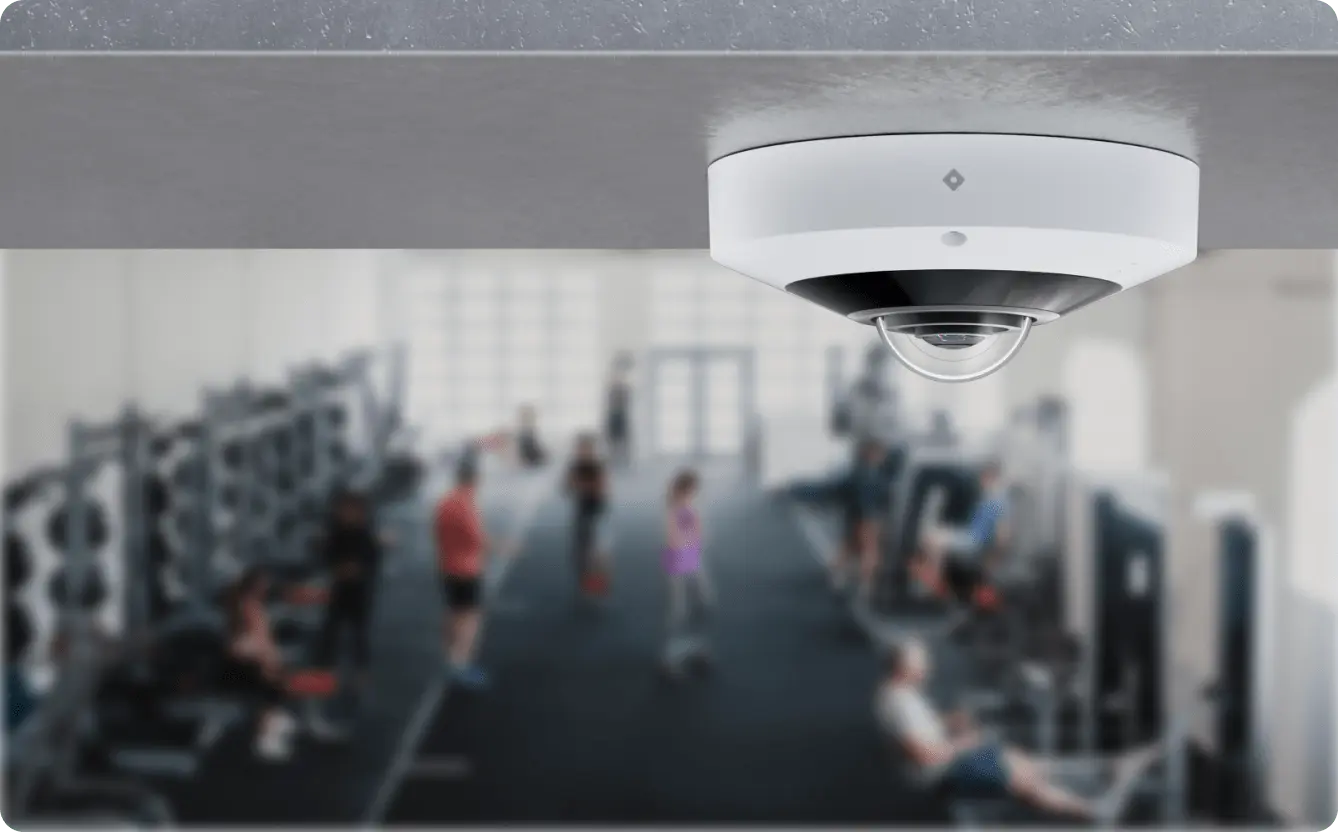 Rhombus R360S fisheye camera installed outdoors, providing panoramic views for wide area surveillance and is NDAA compliant.