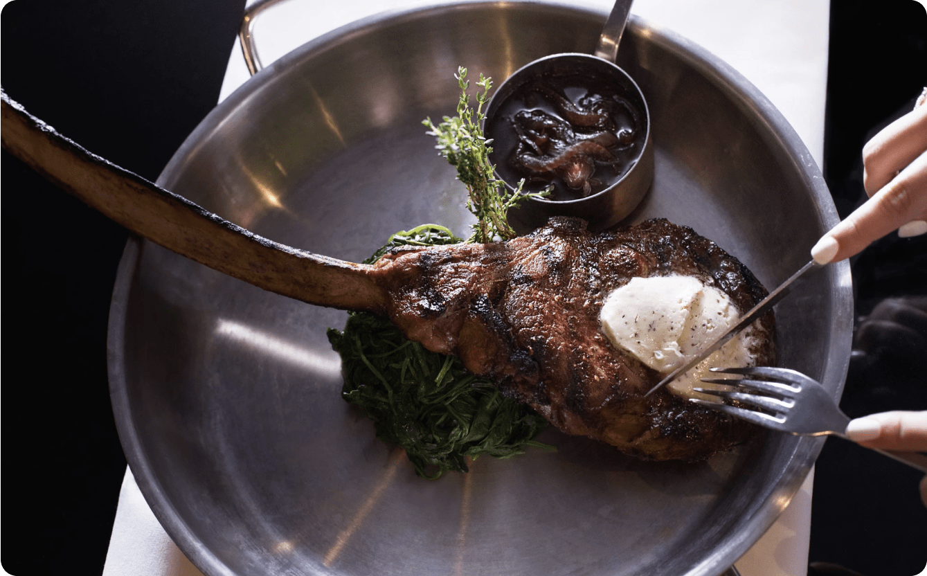 Enjoy an unforgettable dinner featuring a menu of exquisite dishes  with options like crab cake, shrimp cocktail, a selection of prime steaks, garlic mashed potatoes, steamed asparagus, and decadent desserts, such as crème brûlée or s'mores fudge brownie.
