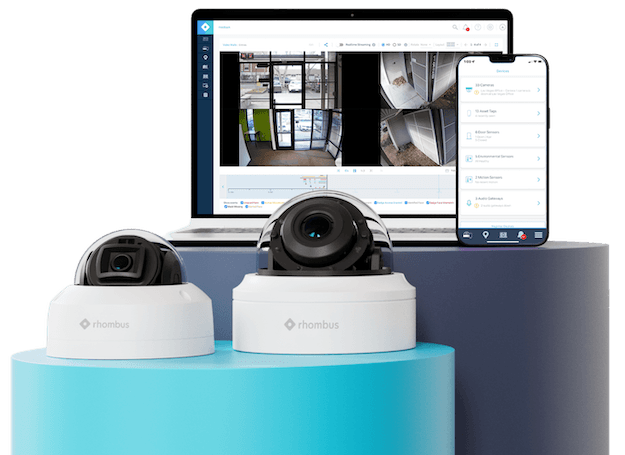 Poduim with two Rhombus cameras and a computer and phone showing the console