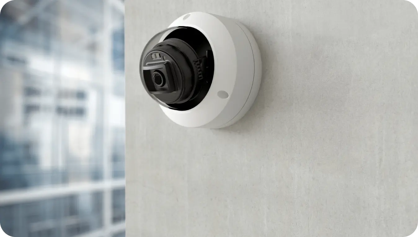 Dome business security cameras mounted on office buildings provide commercial surveillance with video footage that keep businesses safe